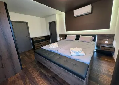 a bedroom with a bed with two towels on it at Dream Home A21 in Sofia