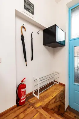 a room with two umbrellas hanging on the wall at Apt Kosmos in the best Central Area in Plovdiv in Plovdiv