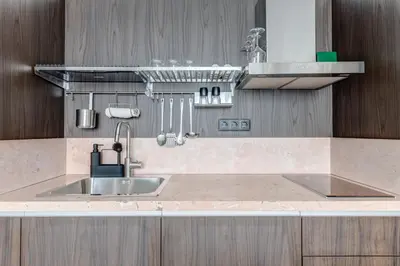 a kitchen with a sink and a counter top at Splendid 1BDMApartment Near Shopping Mall & Metro in Sofia