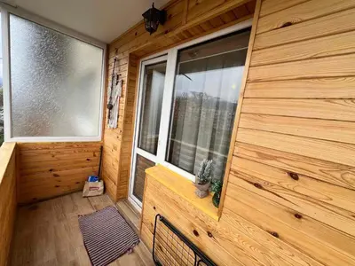 an inside view of a cabin with two large windows at Lovely cozy vintage apartment in Kyustendil