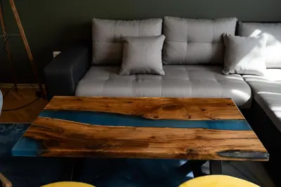 a living room with a couch and a wooden coffee table at 1 Minute Walk to Main Street Vitoshka, NDK, Free Parking, 2 BDR in Sofia