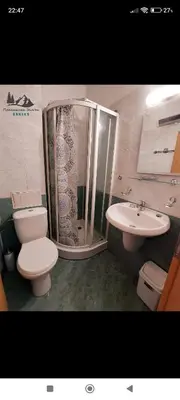 a bathroom with a toilet and a shower and a sink at Comfy Studio in Bansko