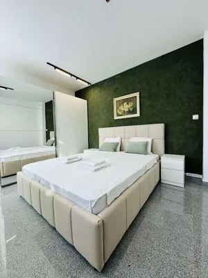 a large bedroom with a large bed in it at Green Accent Apartment in Sofia