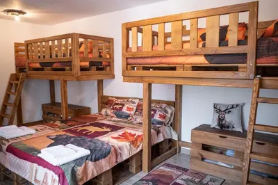 a bedroom with two bunk beds and a bed at Yaninata Art House in Teteven in Teteven