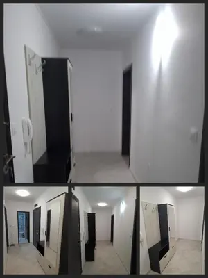 a white room with a door and a hallway at Апартамент Актив Спорт Гранд in Pazardzhik