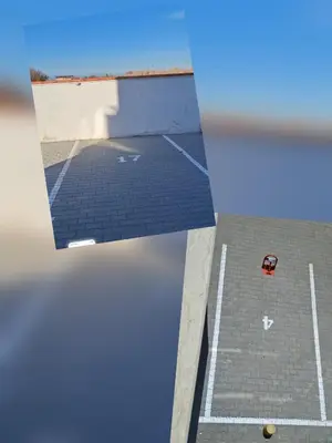 a view of a parking lot with a car on the ground at Апартамент Актив Спорт Гранд in Pazardzhik