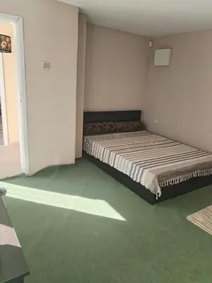 a bedroom with a large bed in a room at Вила 