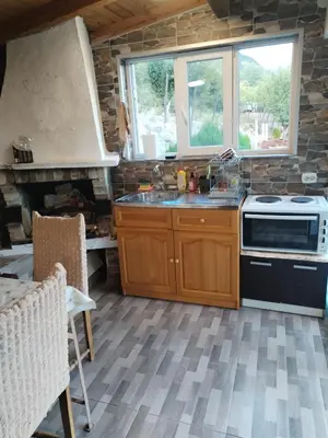 a kitchen with a sink and a stove at Вила 