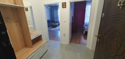 a room with a hallway with a mirror and a door at SUPERsonicondo in Plovdiv