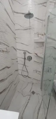 a bathroom with a shower with a glass door at SUPERsonicondo in Plovdiv