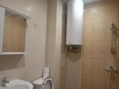 a small bathroom with a toilet and a sink at Apartment B35, complex Sokolitsite in Pamporovo