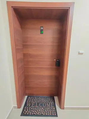 a wooden door with a welcome sign on it at Apartment B34, complex Sokolitsite in Smolyan