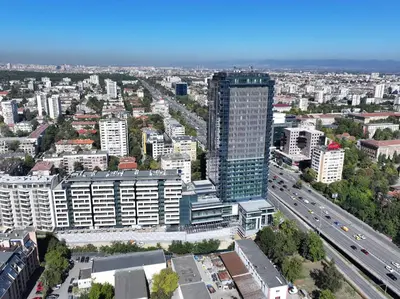 an overhead view of a city with a tall building at East Plaza Hotel in Sofia