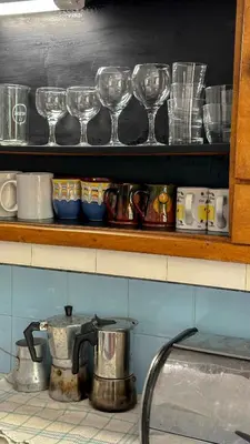 a shelf with wine glasses and cups on it at Camping Kromidovo in Kromidovo