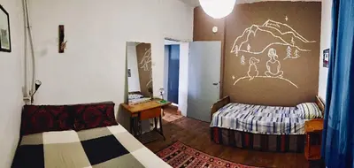 a bedroom with a bed and a drawing on the wall at Camping Kromidovo in Kromidovo