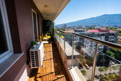 a balcony with a view of a city at Mountain View Sky Apartment Ori 4 in Sofia