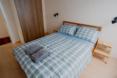 a bedroom with a bed with a backpack on it at Mountain View Sky Apartment Ori 4 in Sofia