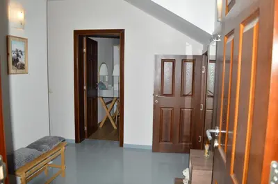 a hallway with a door leading to a bedroom at Cozy apartment for overnight stays Hristo Smirnenski in Plovdiv