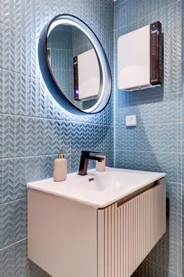 a bathroom with a sink and a mirror at City Gem 1BDRM 200m Sofia Statue in Sofia