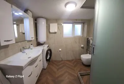 a bathroom with a sink and a toilet at Guest Suite SUZY in Petrich
