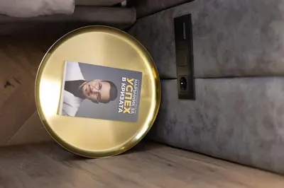 a gold mirror with a picture of a man at Art Retreat Zaimov in Sofia
