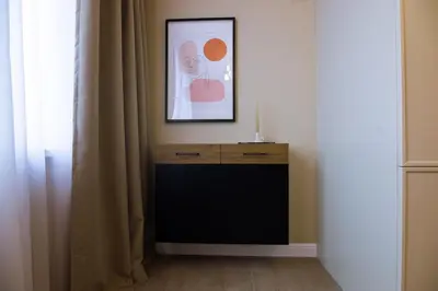 a room with a dresser and a picture on the wall at Art Retreat Zaimov in Sofia