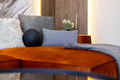 a living room with a couch and pillows at Art Retreat Zaimov in Sofia