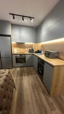 a kitchen with a stove and a microwave at Apartment Maritsa View 1 in Plovdiv