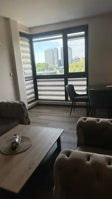 a living room with a couch and a coffee table at Apartment Maritsa View 1 in Plovdiv
