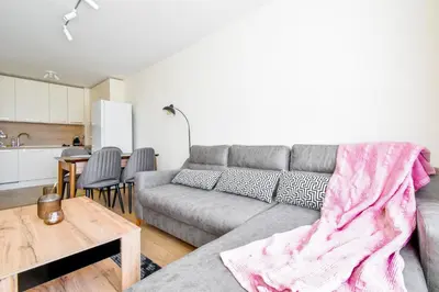 a living room with a couch and a table at Contemporary City Stay by Flat Mаnager in Sofia