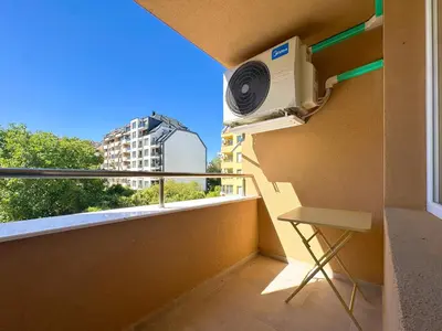 a room with a balcony with a air conditioner at Contemporary City Stay by Flat Mаnager in Sofia