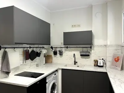 a kitchen with a sink and a washing machine at Modern 100m Apt In Sofia Center Vitosha Blvd in Sofia