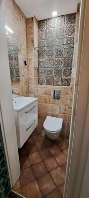 a bathroom with a toilet and a sink at Bright apartment in Doktorska gradina in Sofia