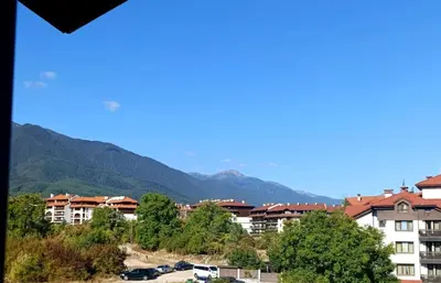 a view of a city with mountains in the background at Moderno Studio Park Lane in Bansko