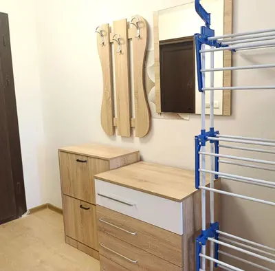 a closet with skis hanging on the wall at Moderno Studio Park Lane in Bansko