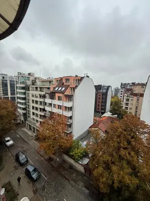 a view of a city with buildings and trees at Central Mansard Studio in Sofia