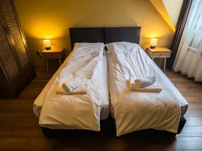 a bed with two towels on it in a room at Venti club B15 in Sofia