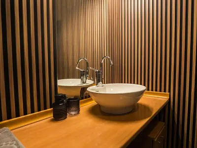 a bathroom with a bowl sink on a wooden counter at Venti club B15 in Sofia