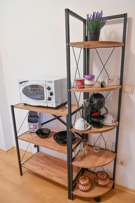 a shelf unit with a microwave and a microwave at Charming Studio with Mountain View - Bansko by Flat Mаnаger in Bansko