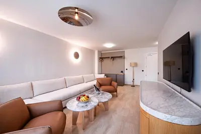 a living room with a couch and a table at Nik Palas Luxury Residence in Sandanski