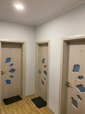 a room with two doors with blueprints on the wall at Къща за гости Elion House in Hisarya