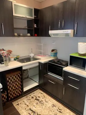 a kitchen with a sink and a stove at Къща за гости Elion House in Hisarya