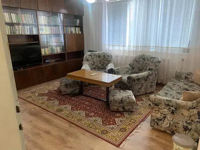 a living room with a table and two chairs at Къща за гости Elion House in Hisarya