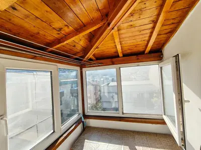 a room with two windows and a wooden ceiling at AlHana Panoramic Studio - Top Center, Blagoevgrad in Blagoevgrad
