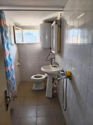 a small bathroom with a toilet and a sink at AlHana Panoramic Studio - Top Center, Blagoevgrad in Blagoevgrad