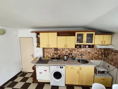 a small kitchen with a washing machine in it at AlHana Panoramic Studio - Top Center, Blagoevgrad in Blagoevgrad