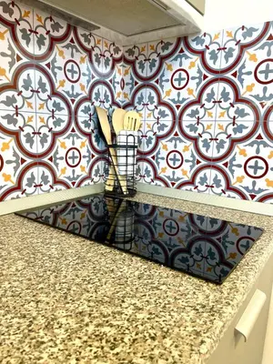 a kitchen counter with a patterned wall at Mountain Escape in Green Life Bansko by SI Stay in Bansko