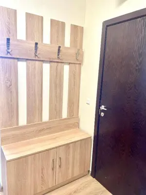 a wooden door in a room with a wooden shelf at Mountain Escape in Green Life Bansko by SI Stay in Bansko