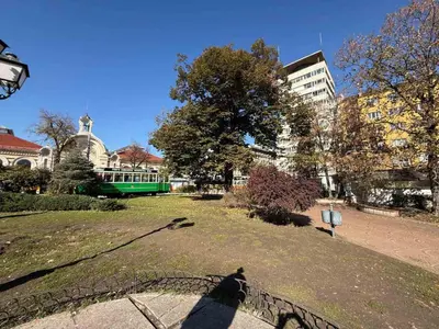 a shadow of a person standing in a park at Апартамент 36 in Sofia
