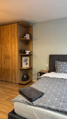 a bedroom with a bed and a book shelf at Urban Hive - Central Designer Studio in Lozenets in Sofia